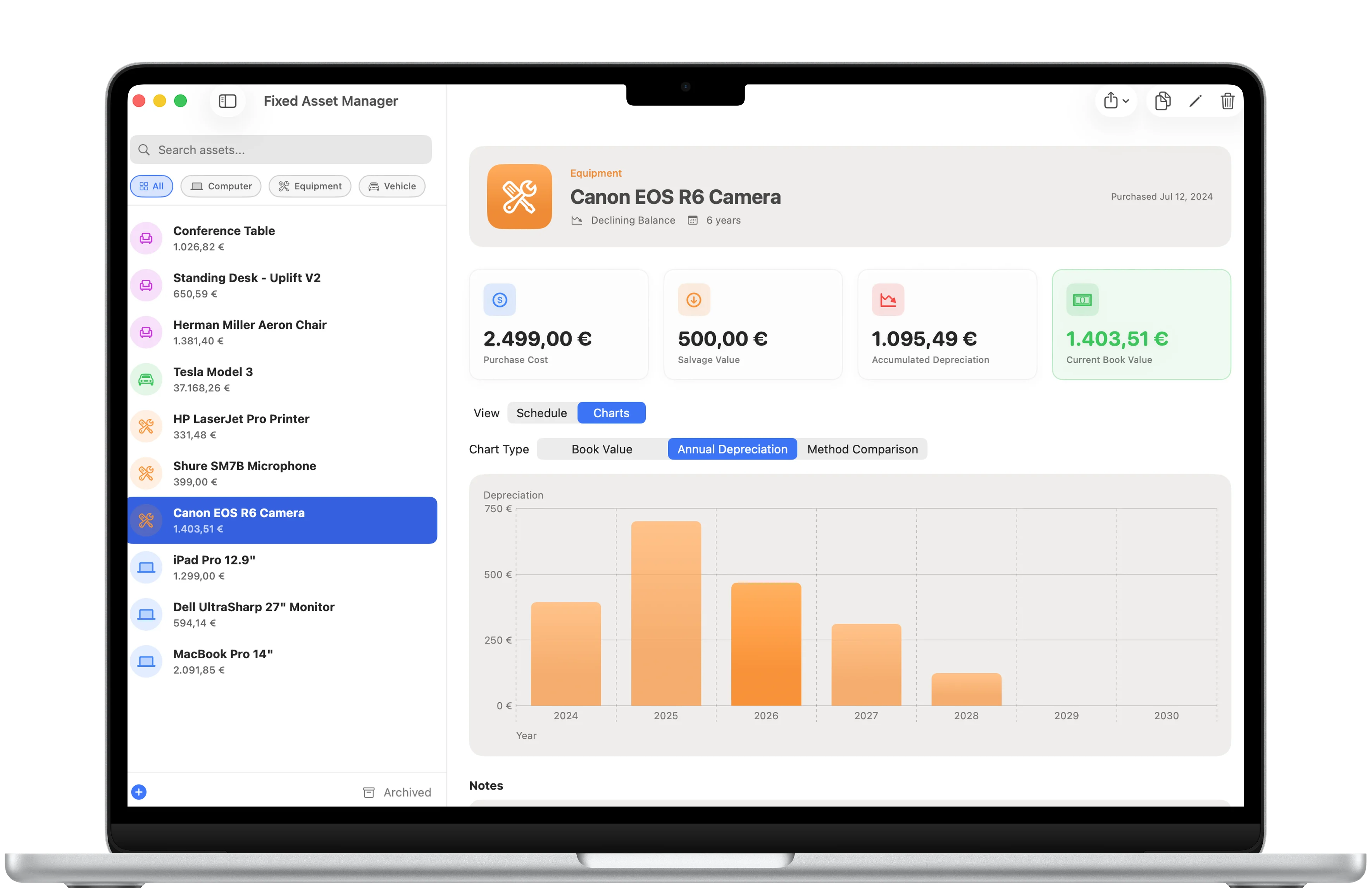 Fixed Asset Manager depreciation schedule framed in a MacBook Air