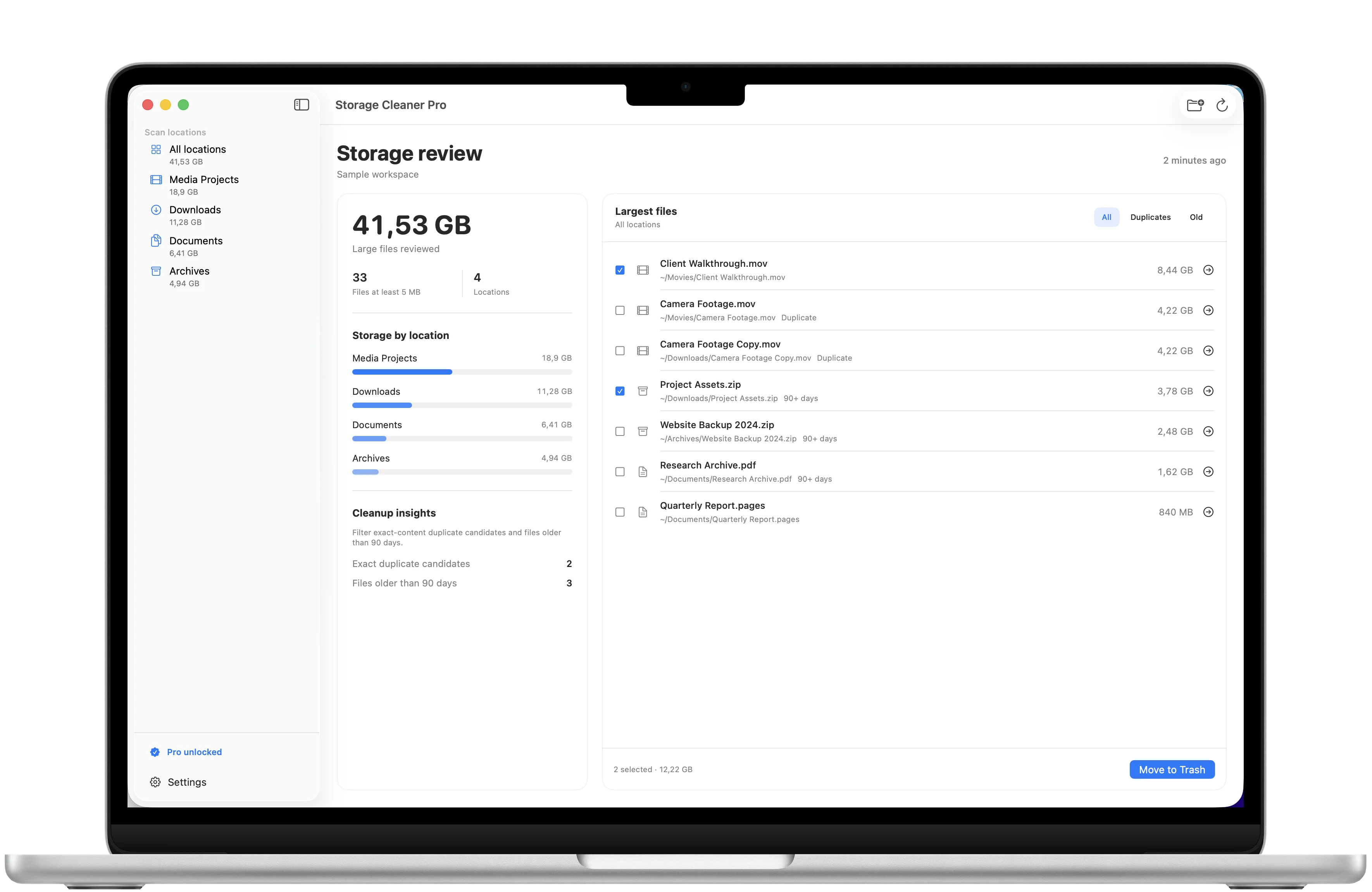 Storage Cleaner Pro largest-file review framed in a MacBook Air with file sizes, paths, selection, and cleanup controls